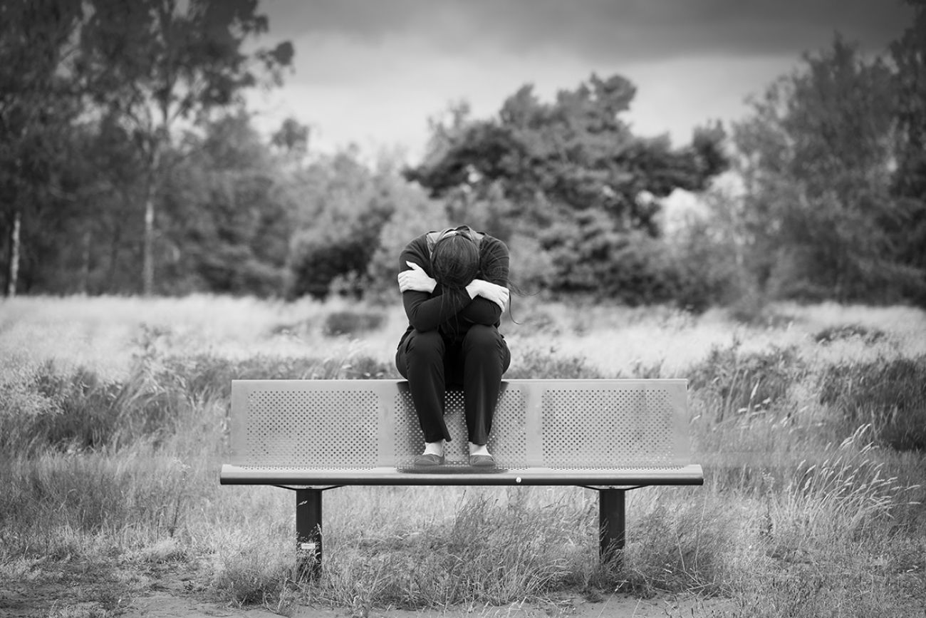 grey and white photo, someone looking sad