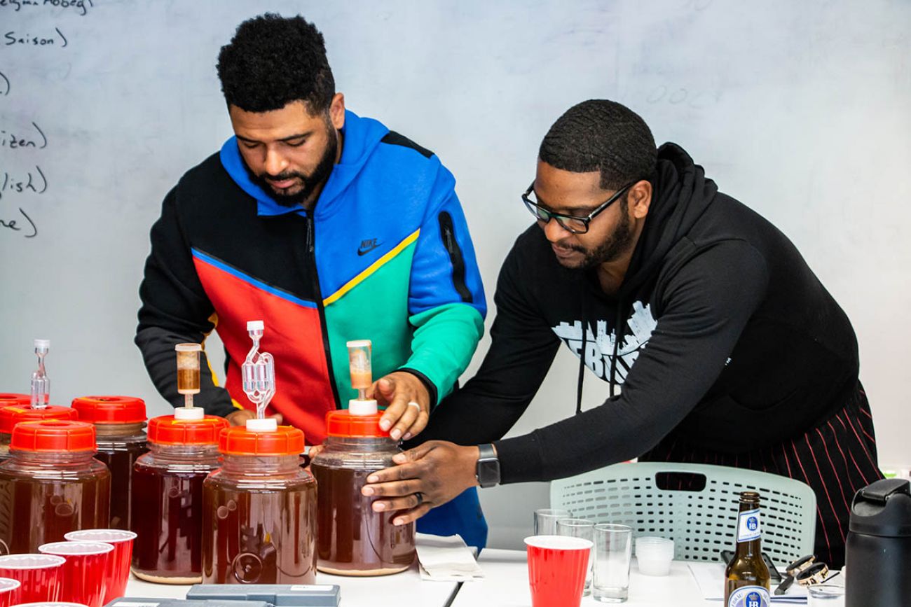 two men making beer