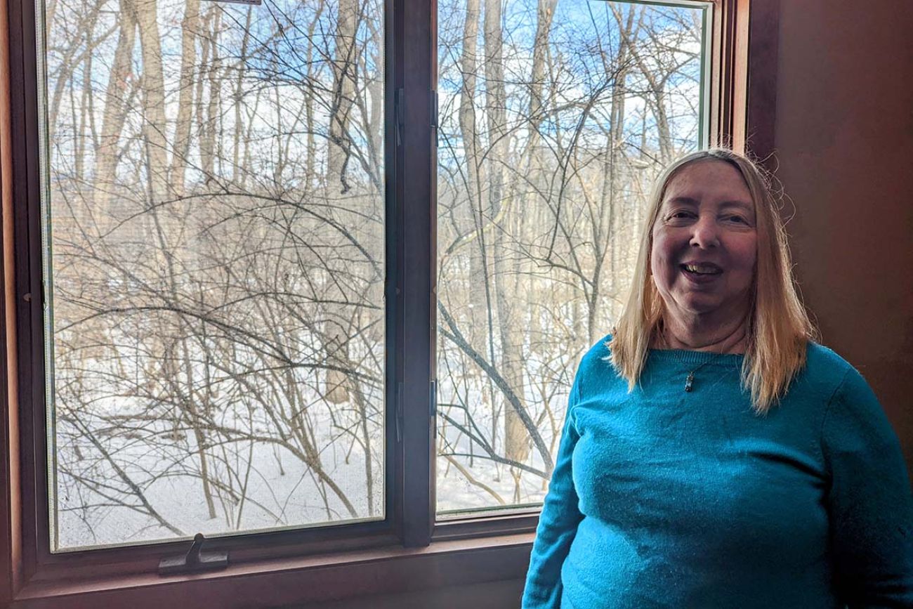 woman in front of window