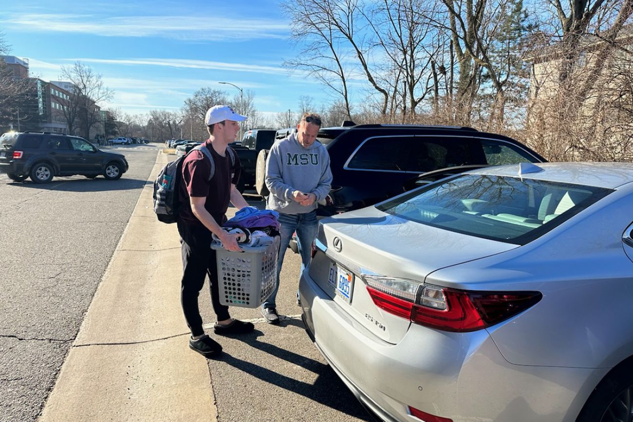 freshman leaving with his dad on MSU campus