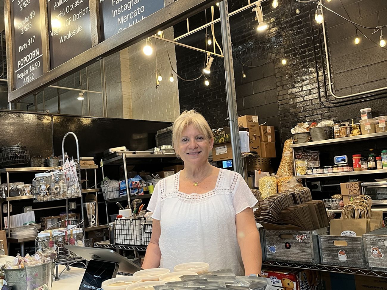 Lisa Robitaille behind the counter of a store