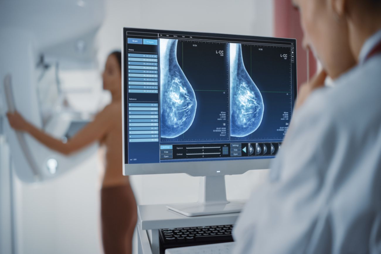 Female doctor looks at breast screening