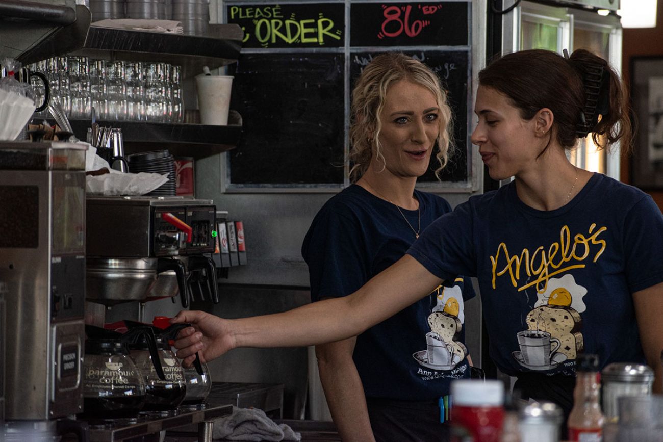 waitresses interacting with each other