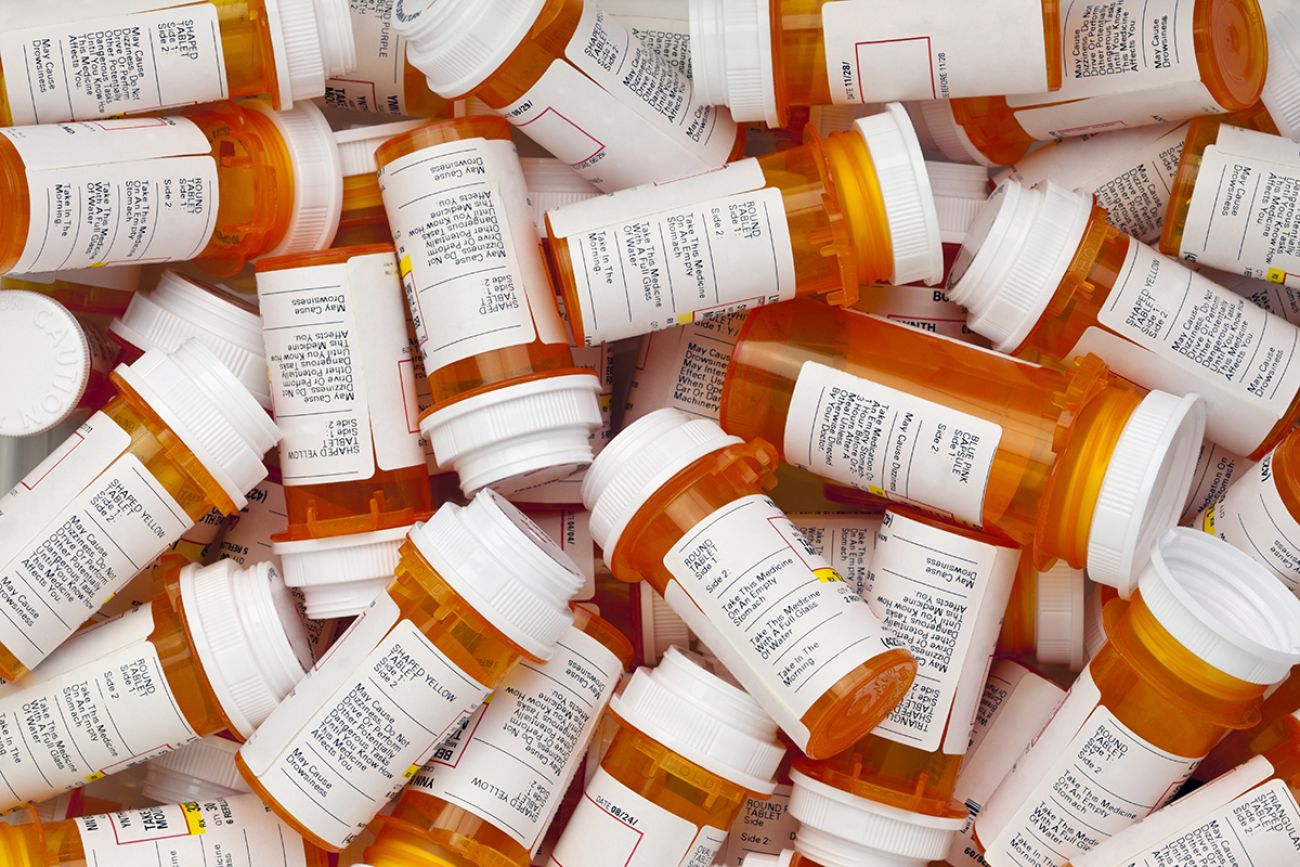 Dozens of prescription medicine bottles in a jumble