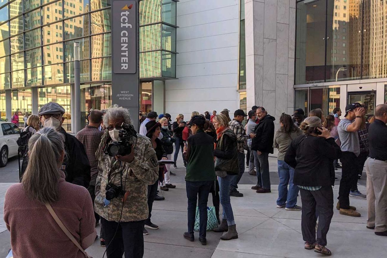 people standing outside the TCF Center in Detroit after the 2020 election