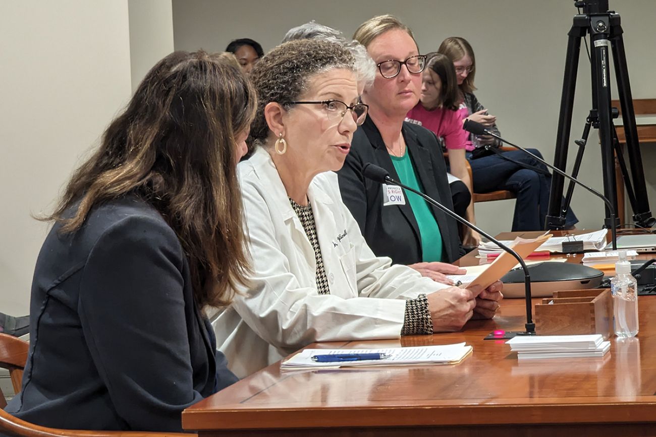 Dr. Michelle Monticello speaking into a microphone