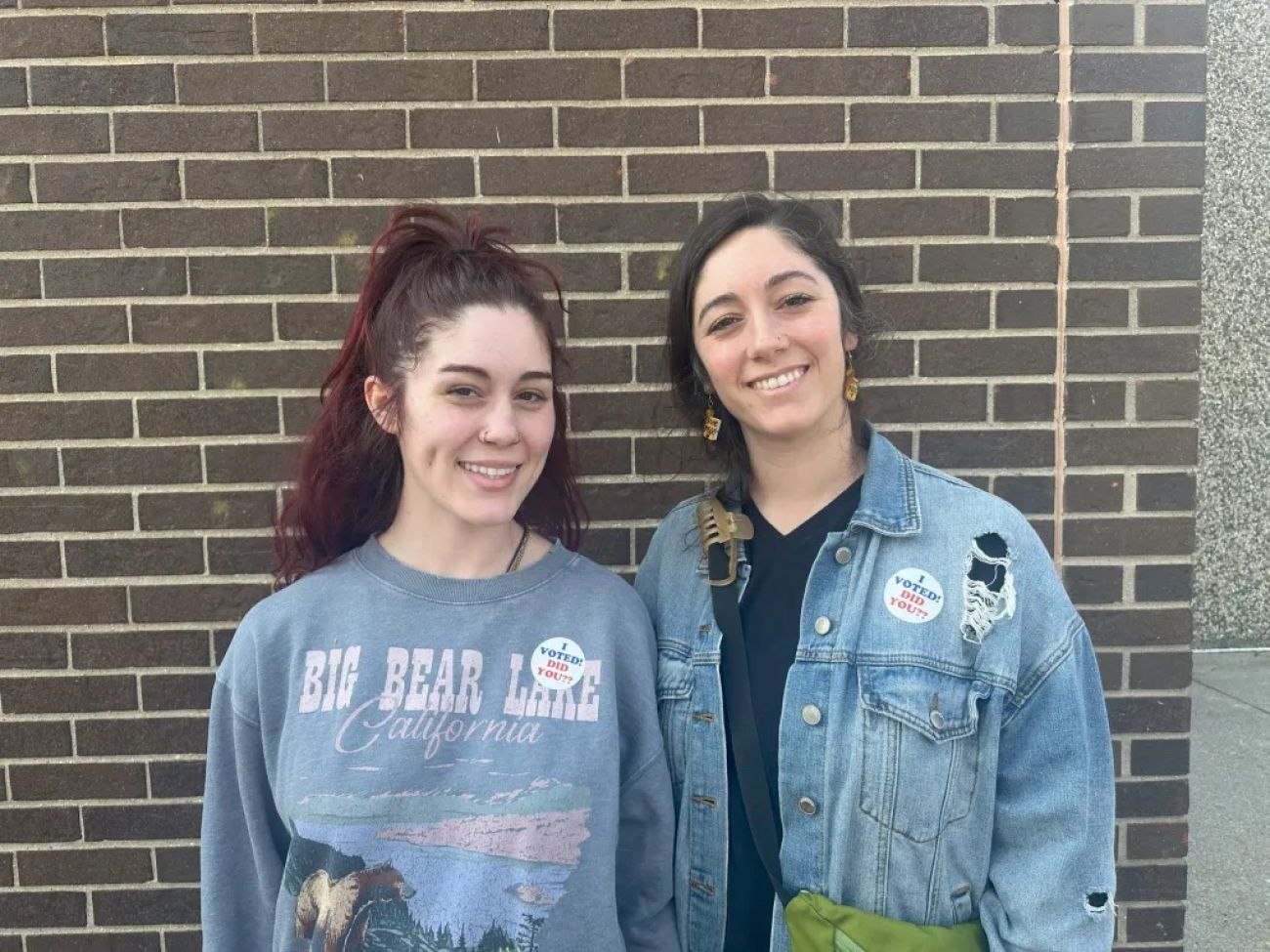 two woman standing next to each other