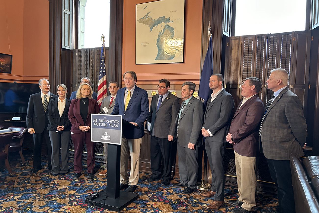 Senate Minority Leader Aric Nesbitt, R-Porter Township, speaks at a podium 