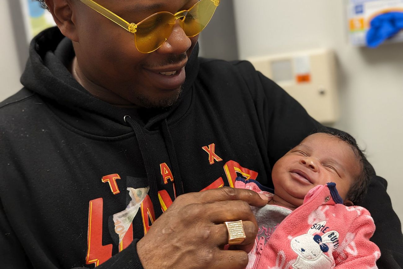 dad holding a baby girl