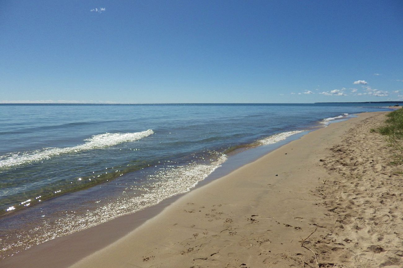 a beach on Lake Michigan on a sunny day