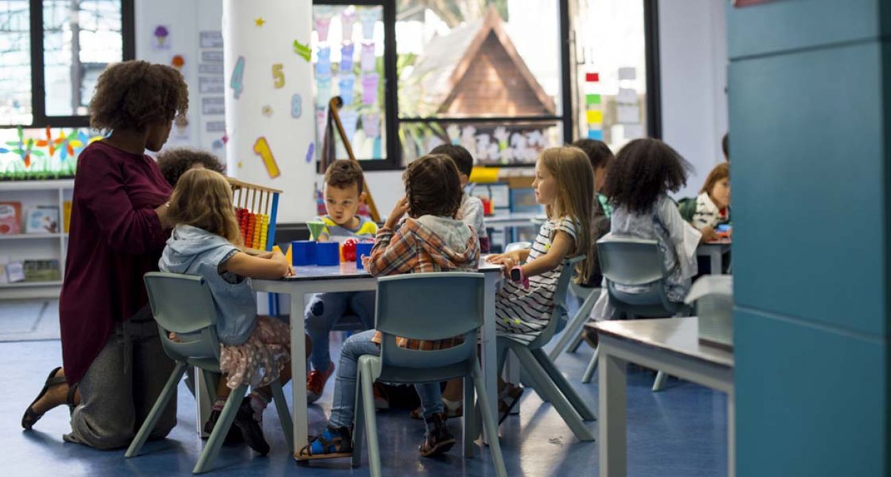 teacher with preschoolers in the classroom