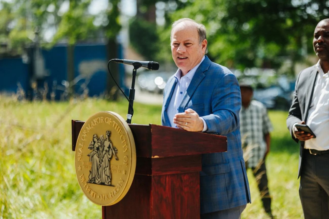 Detroit Mayor Mike Duggan speaking into the microphone