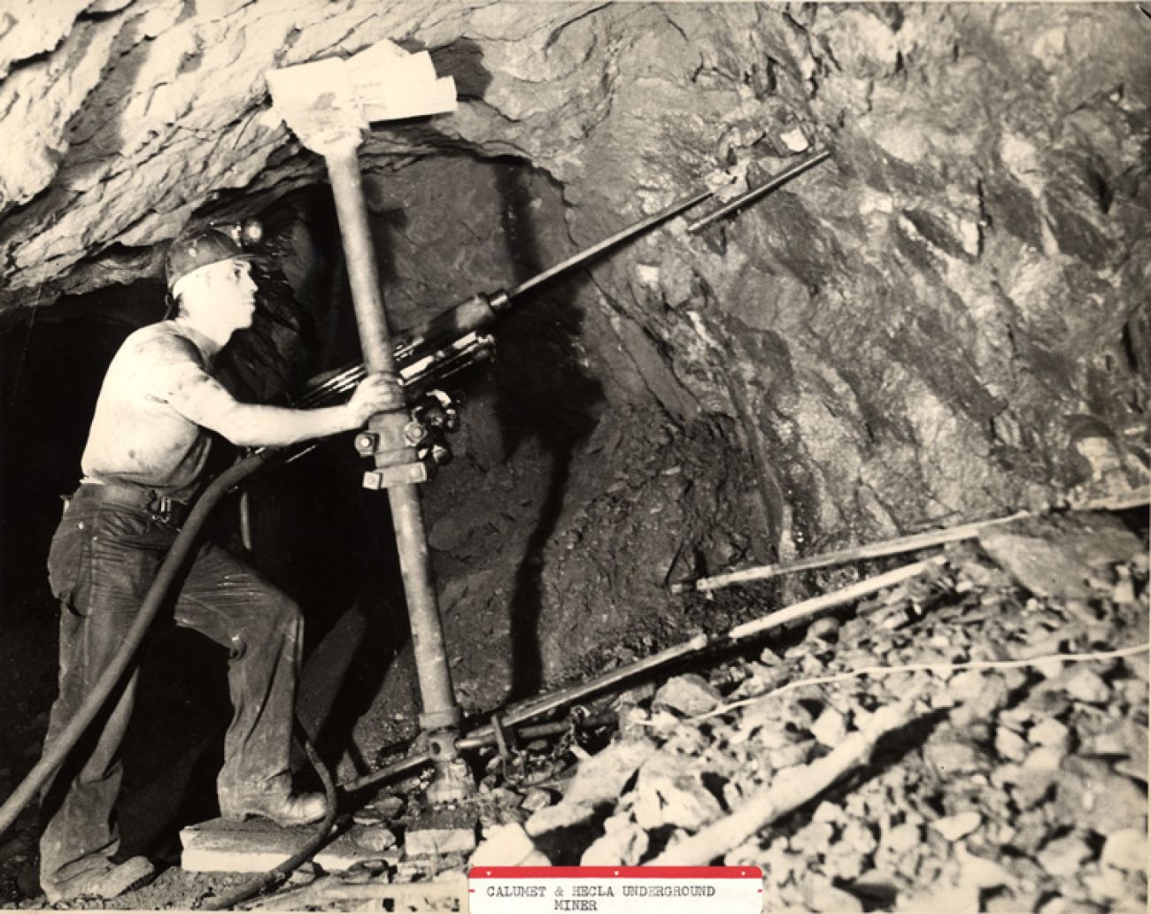 black and white photo of a man in the mine