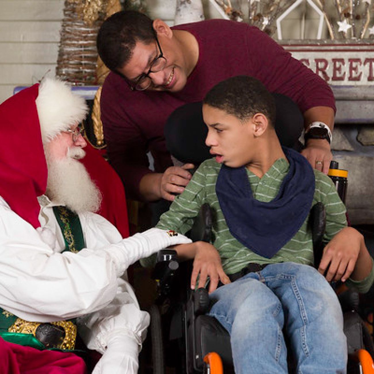 Christopher and his father, Brian, sit with Santa Claus