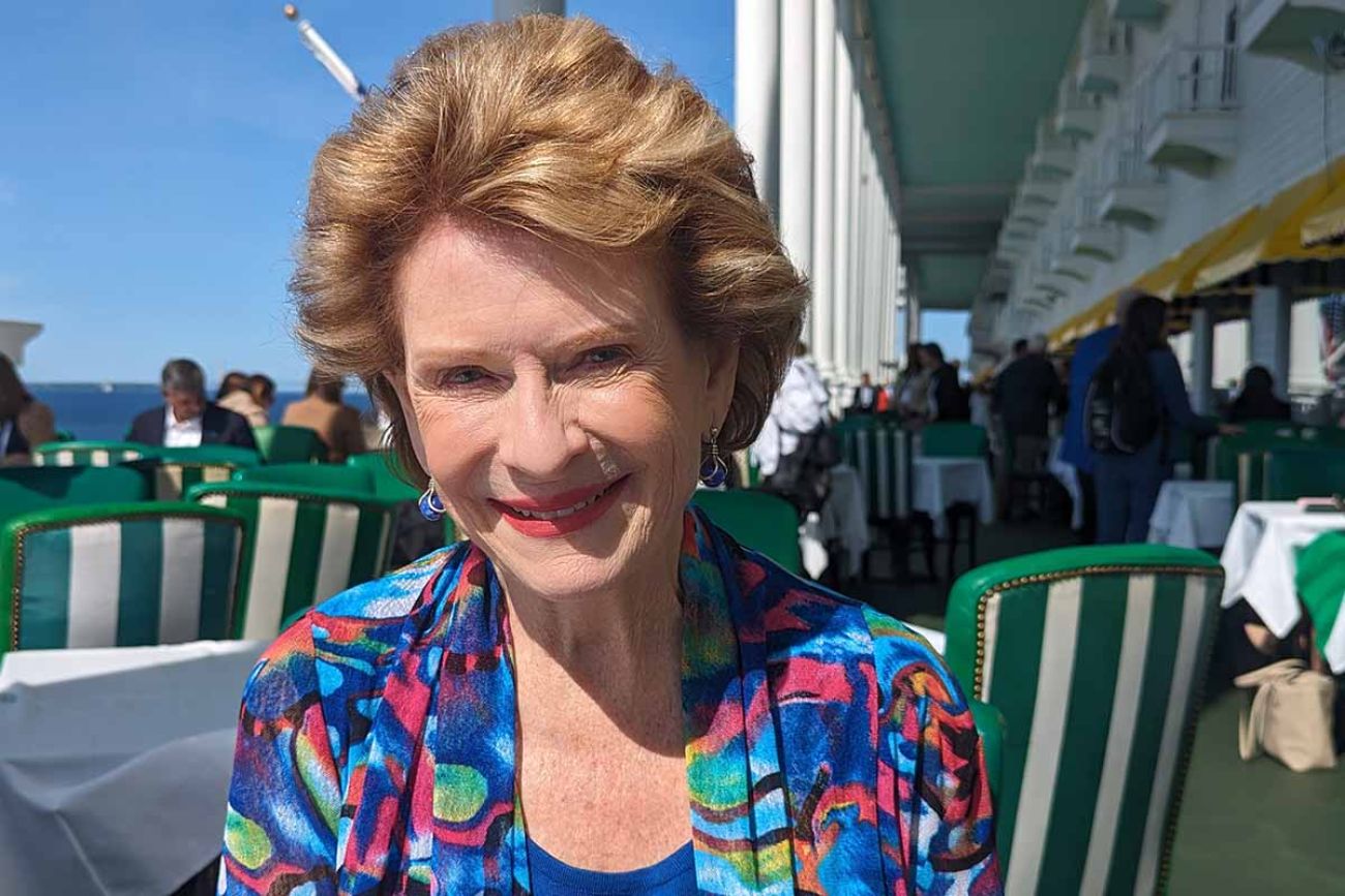 Debbie Stabenow sitting on a porch in Mackinac Island