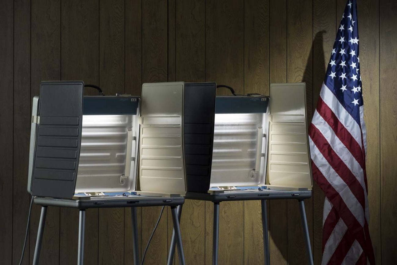 Voting booth and US flag