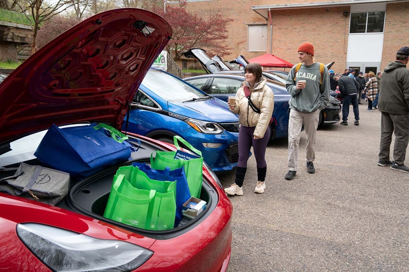 People walking around a car show