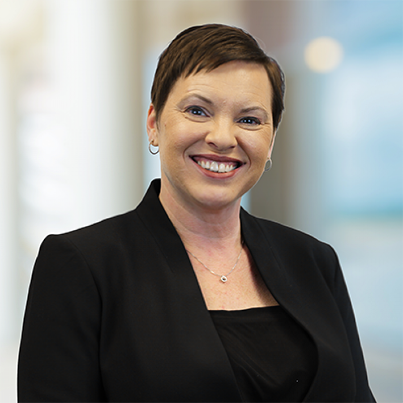 Elizabeth Hertel headshot. She is wearing a black top