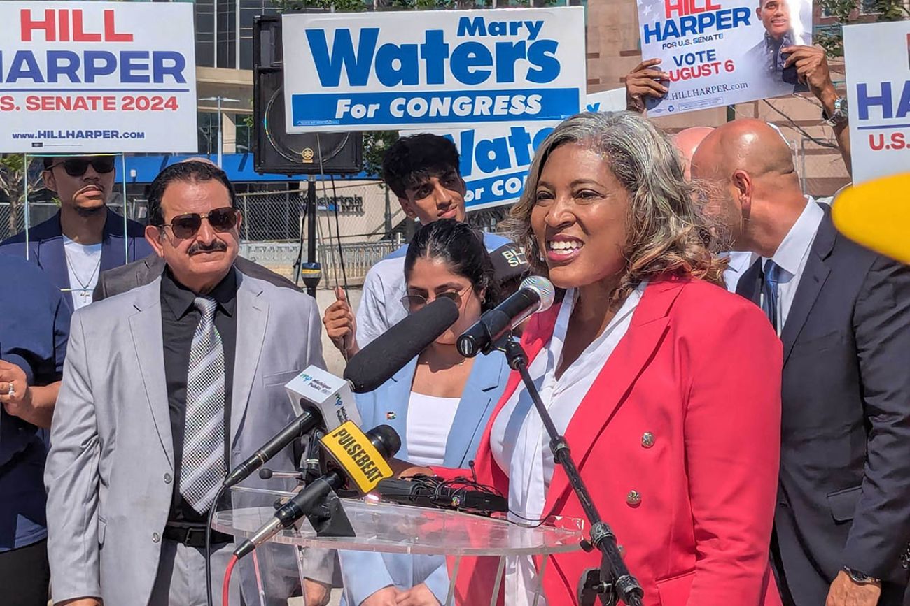 Pamela Pugh speaking into a microphone