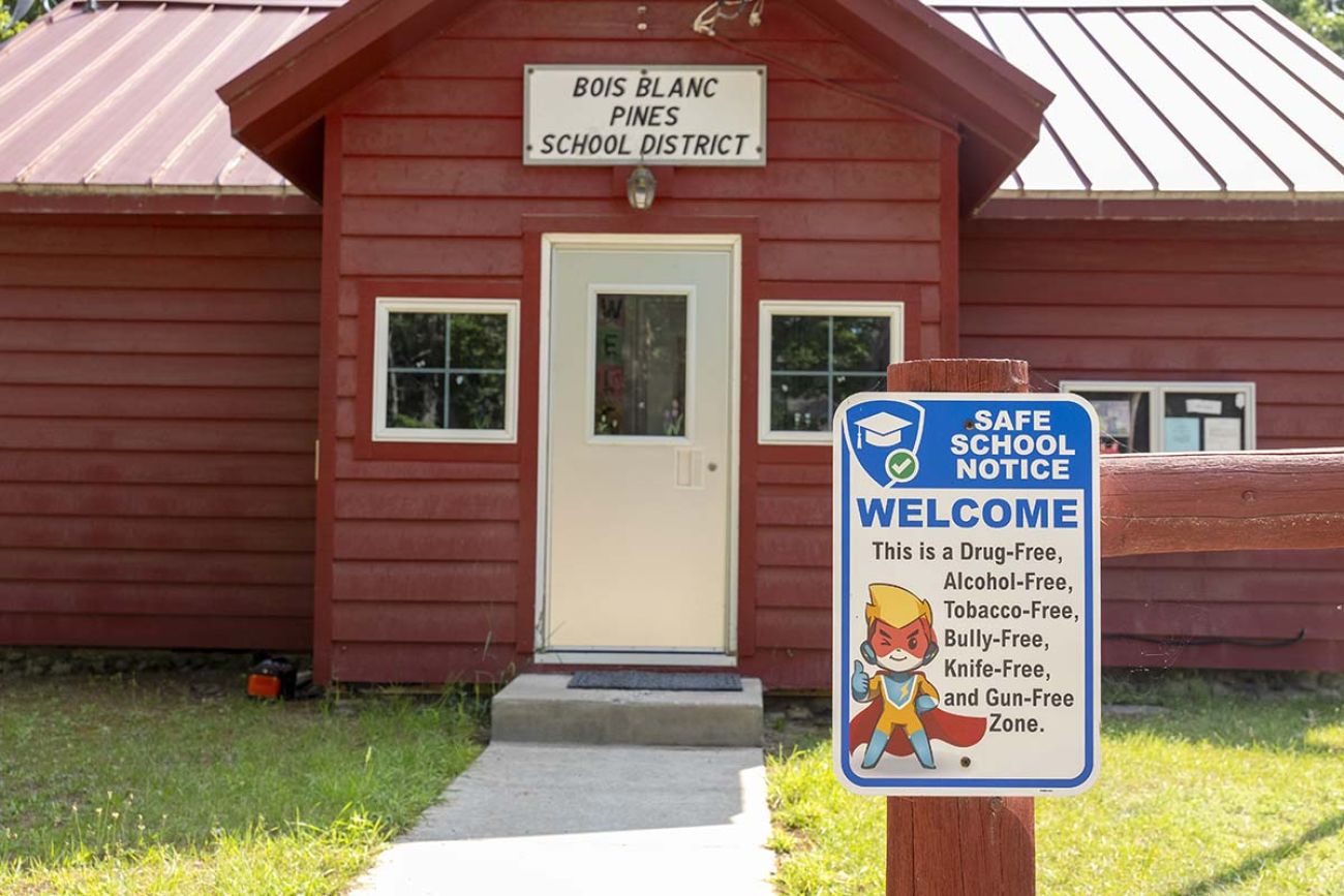 Bois Blanc Pines School, a small red building