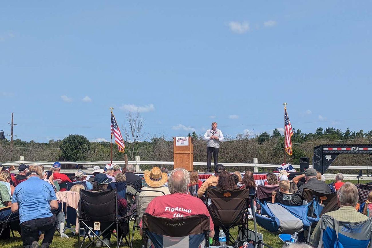 Republican U.S. Senate candidate Mike Rogers on the stage, talking to a crowd