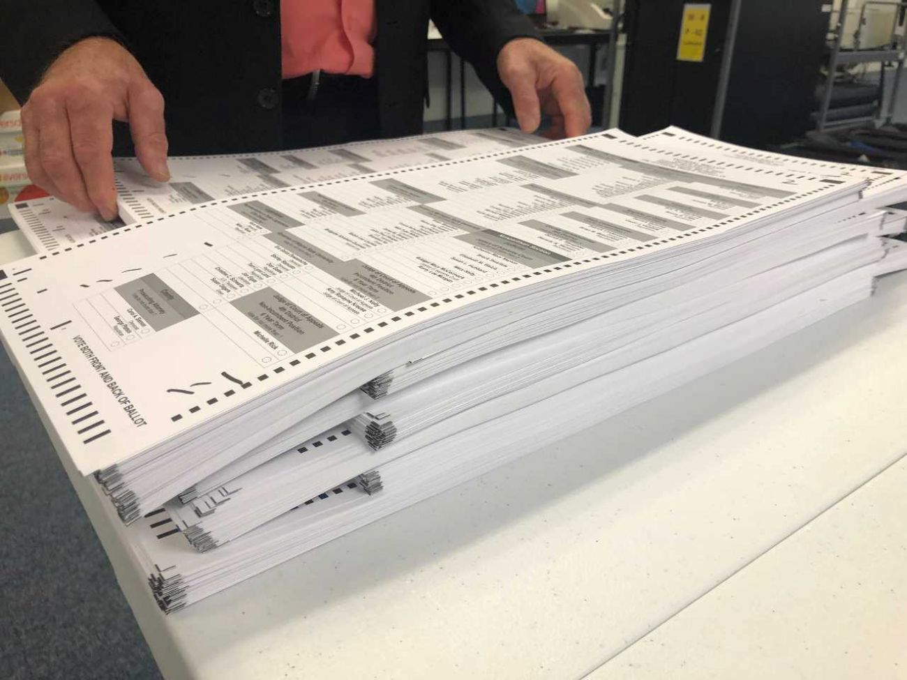 A stack of ballots on a table