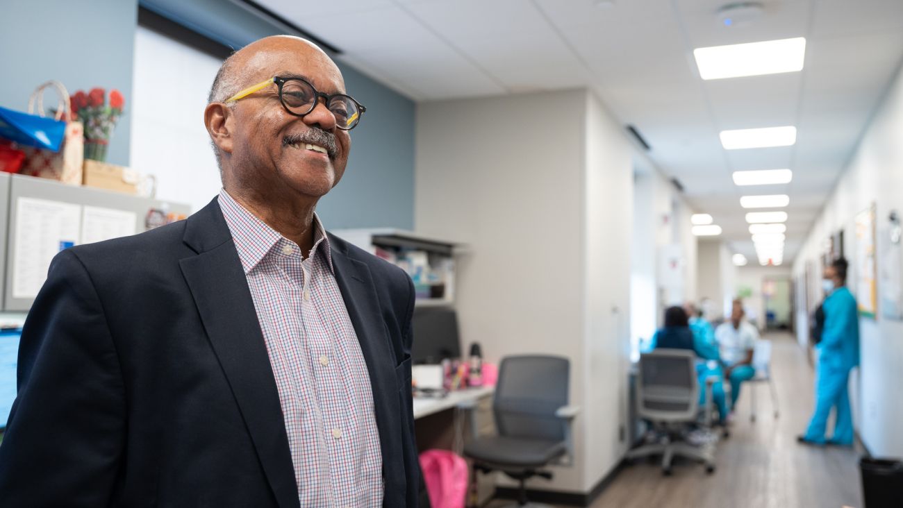 Dr. Herman Gray poses for a picture in a medical building