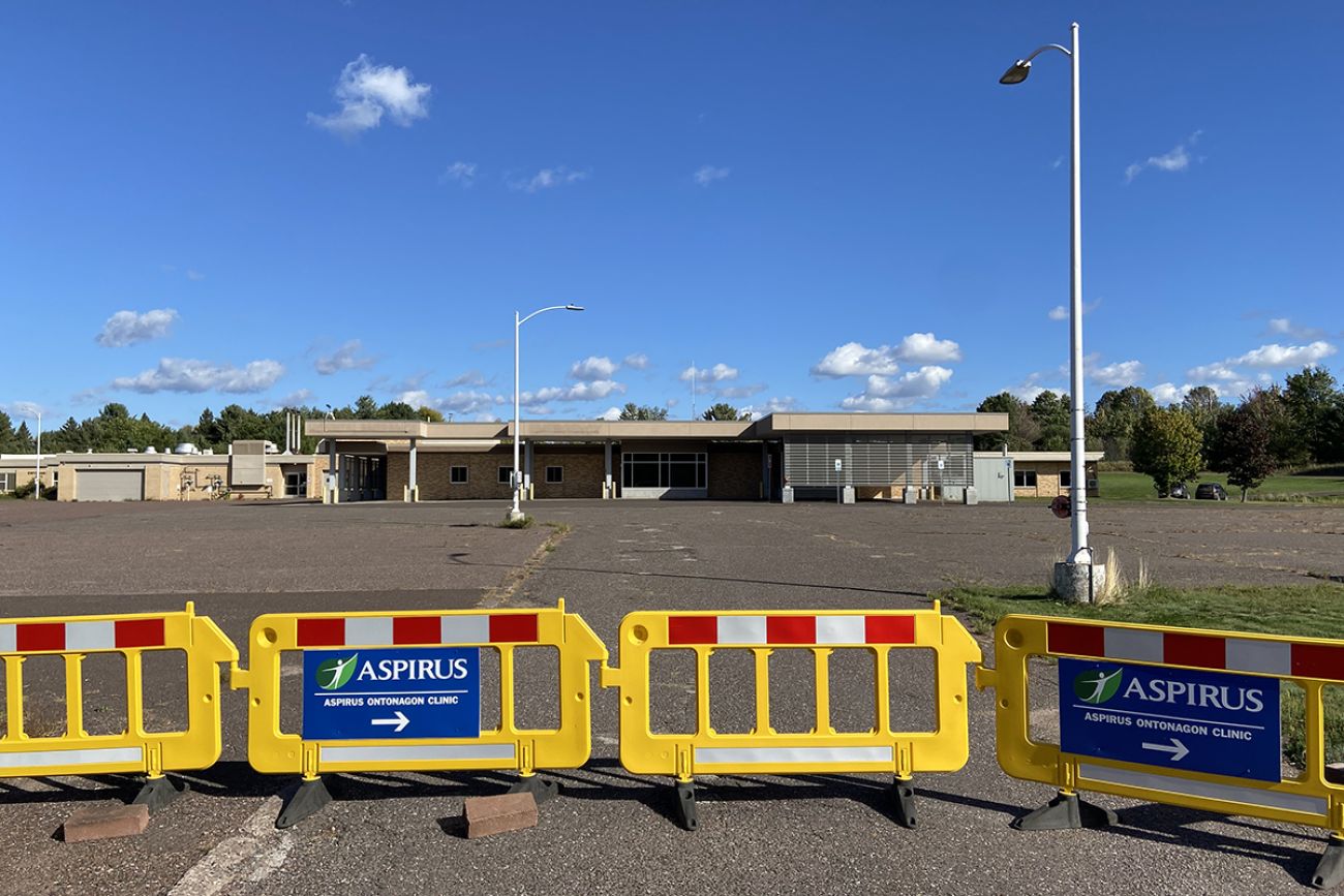 Orange barricades blocking a parking lot 