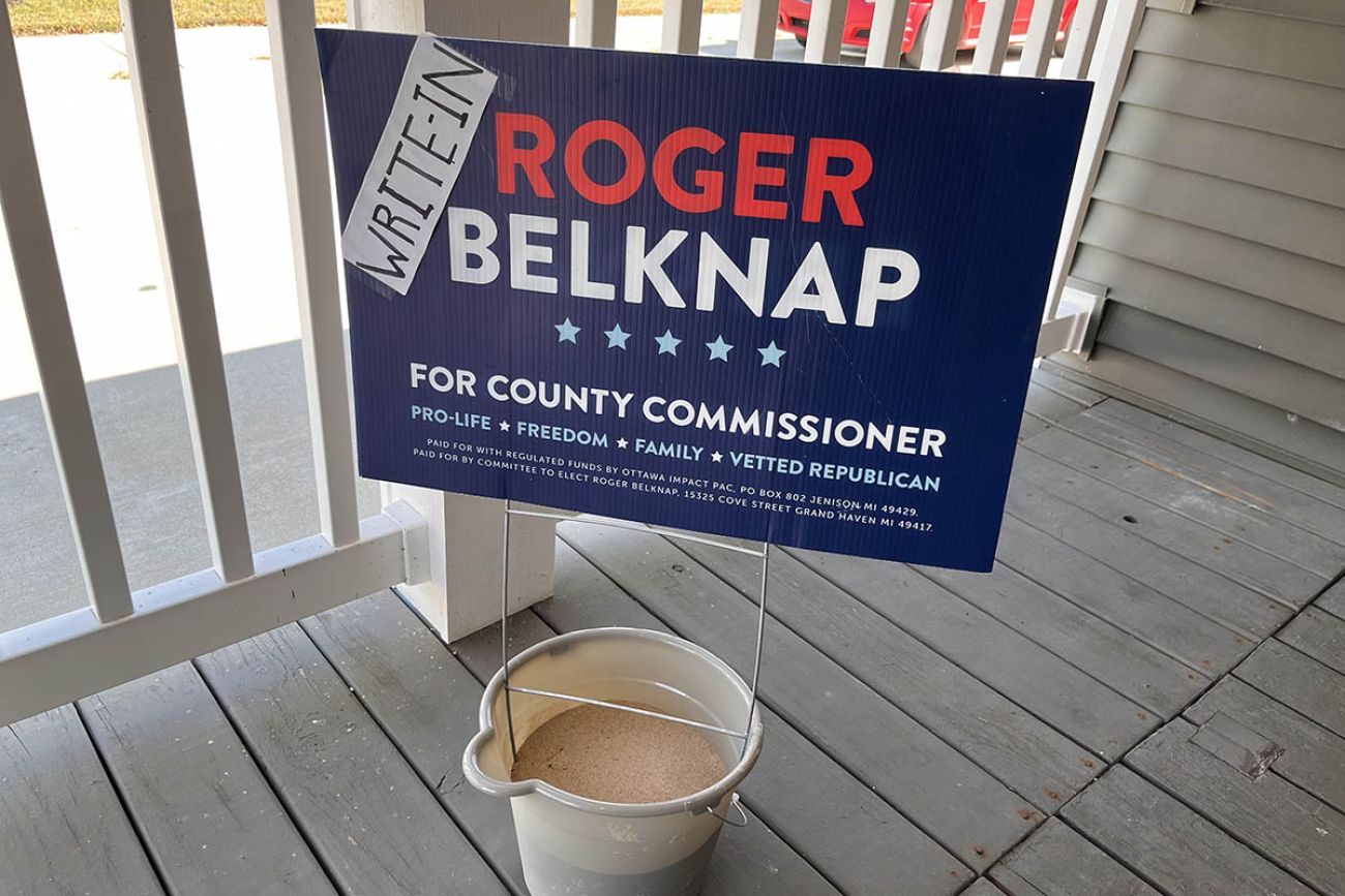 A sign asking people to write in Roger Belknap