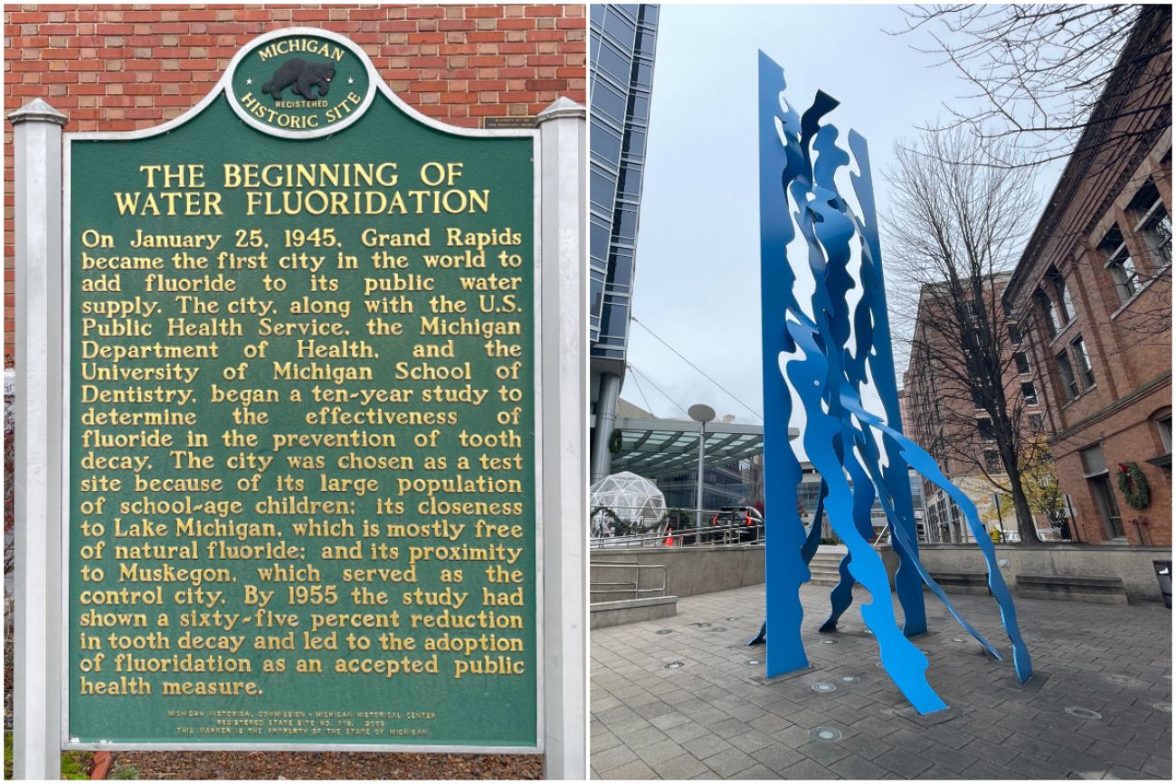 A historical marker on the left and a blue sculpture in downtown Grand Rapids 