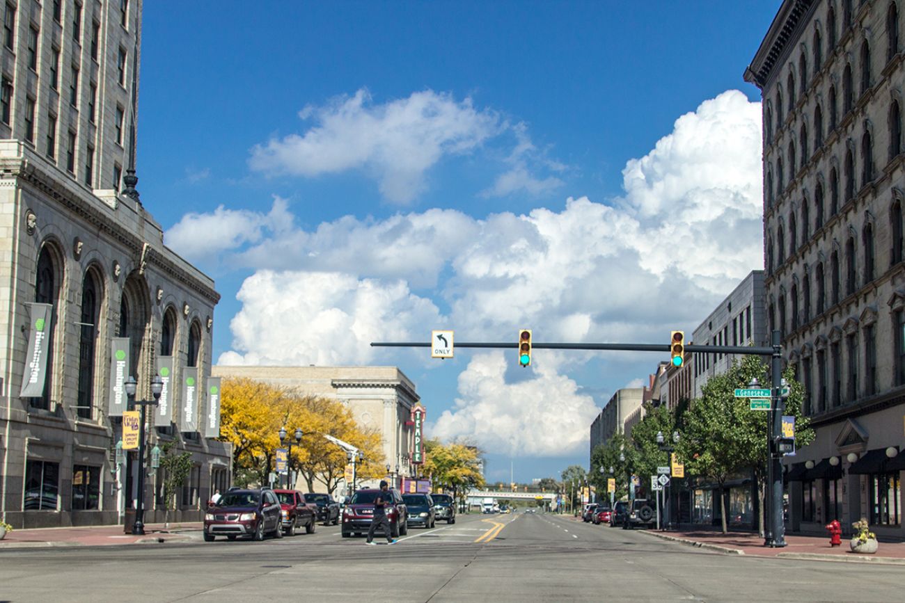 anorama of crosswalk and intersection with traffic in downtown Saginaw, Michigan.