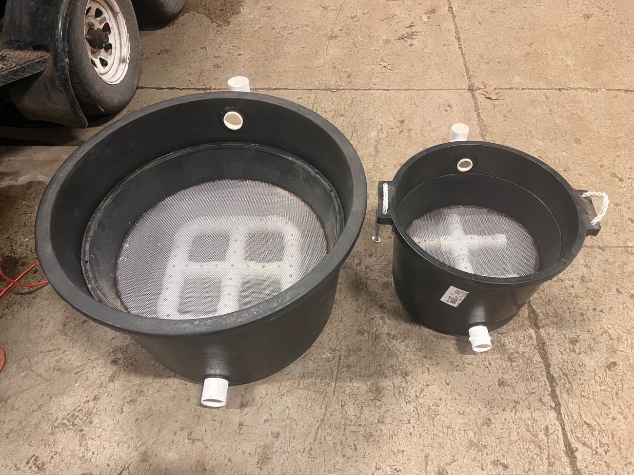 Two black buckets 