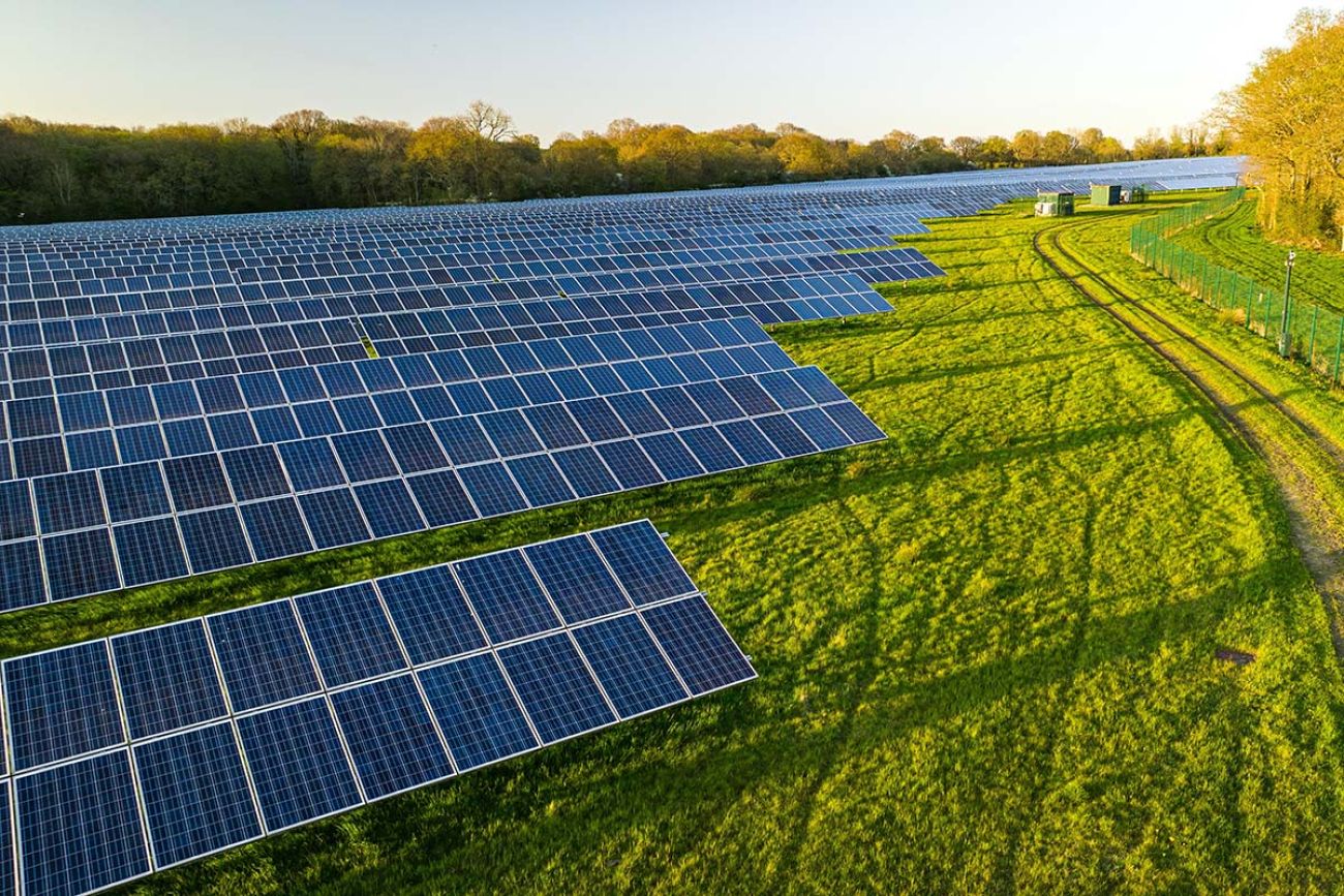 Solar farm; a row of solar panels outside