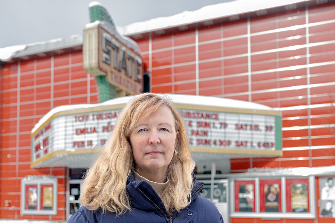 Janie McNabbe standing in front of State Theatre in Traverse City, Michigan.