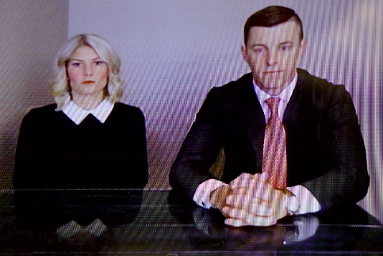 Lee and Stephanie Chatfield on a courtroom TV screen.