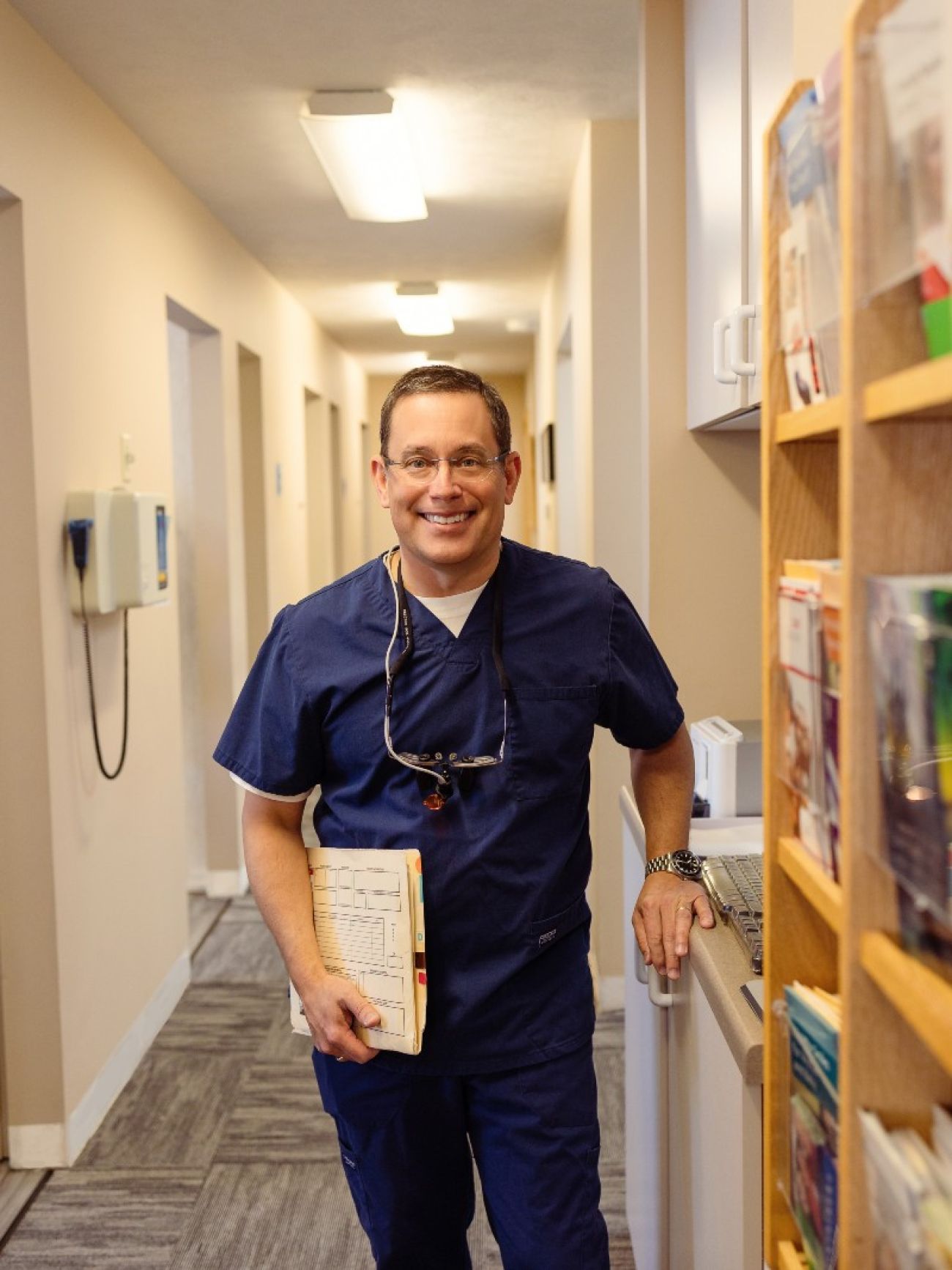 Dentist Eric Knudsen poses in his clinic