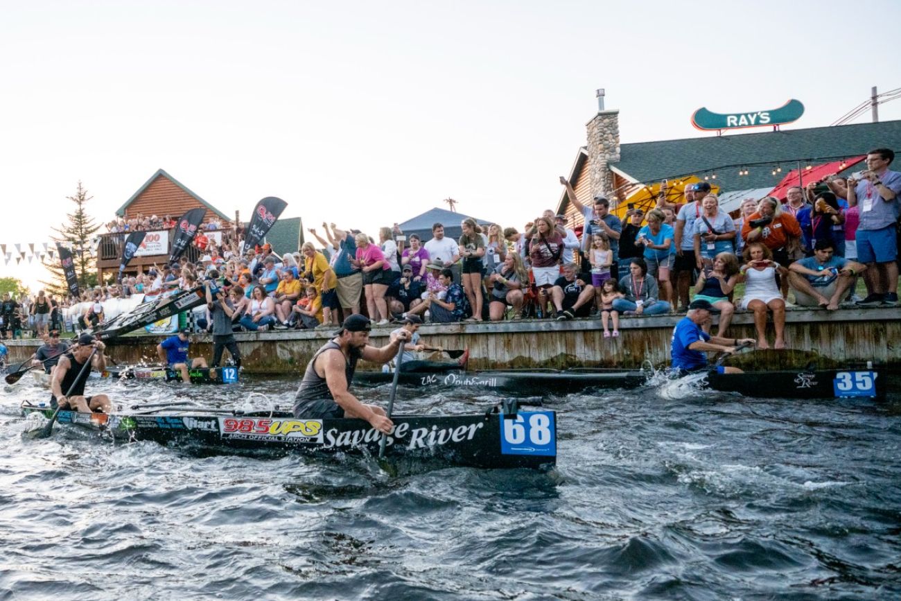 Canoers race down the Au Sable River