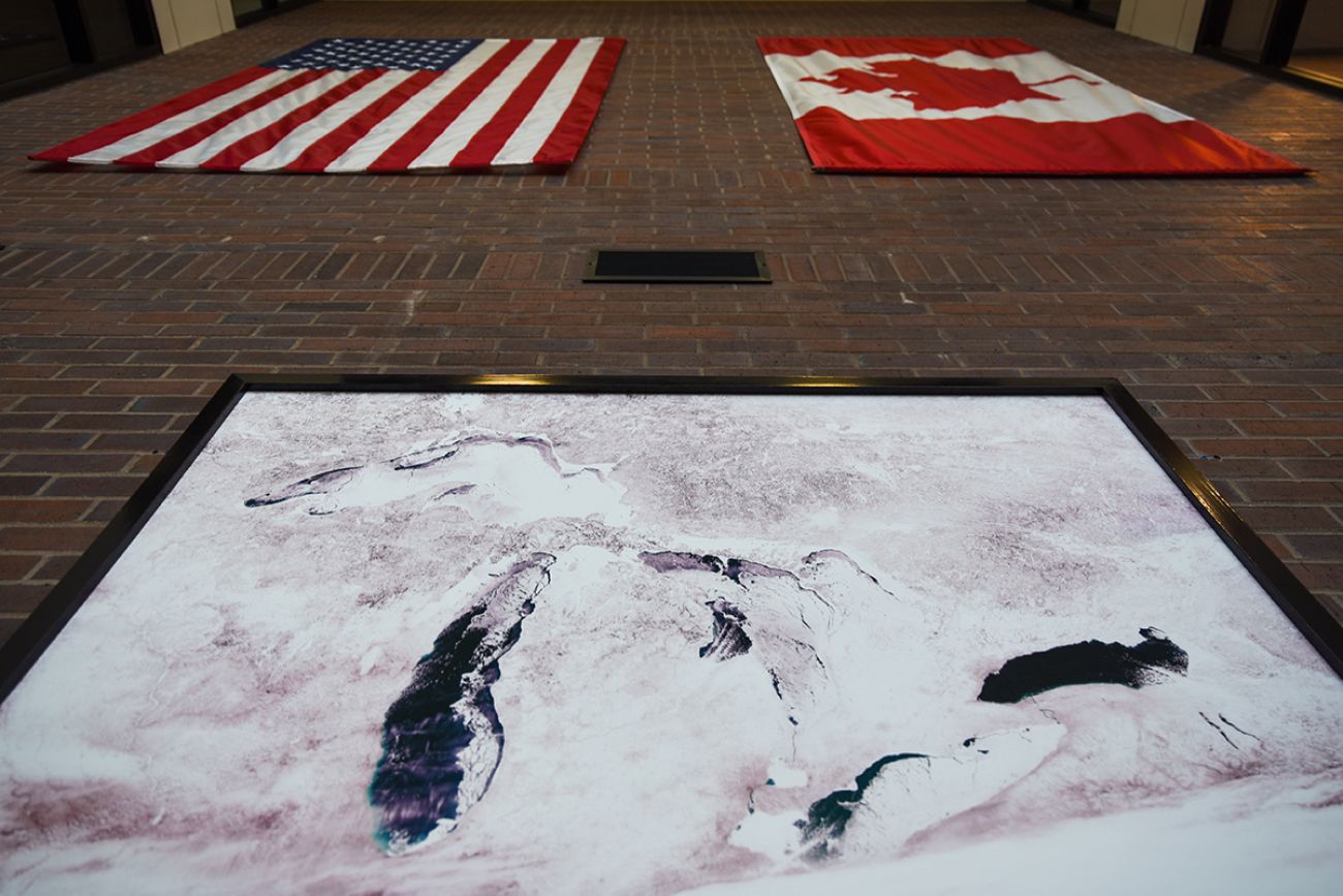 The Great Lakes Fishery Commission lobby has a map of the Great Lakes. There are also the flags for the United States and Canada.
