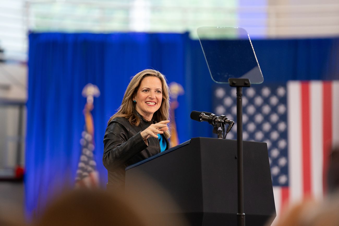  Secretary of State Jocelyn Benson speaking to a crowd. 