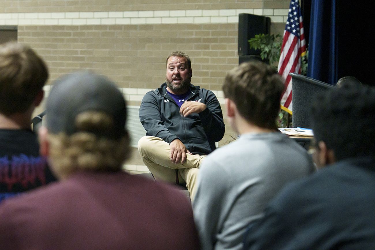 Rosser talks to students. 