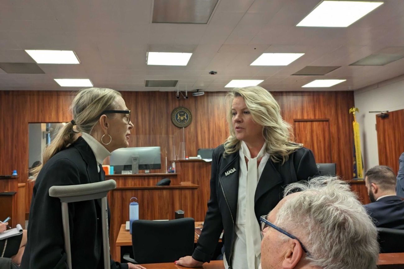 Michele Lundgren and Meshawn Maddock in a courtroom. 