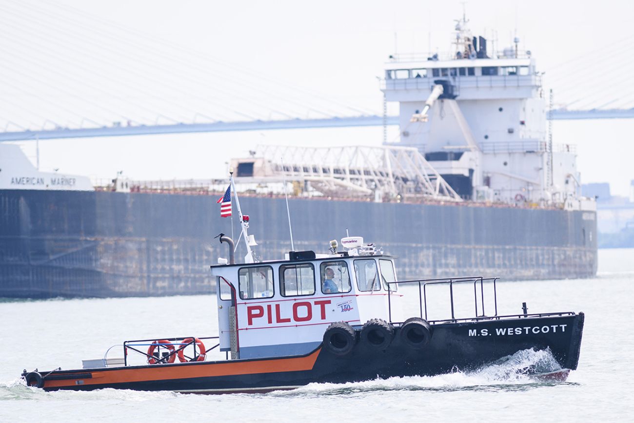 M.S. Westcott in the foreground. A freighter in the background.