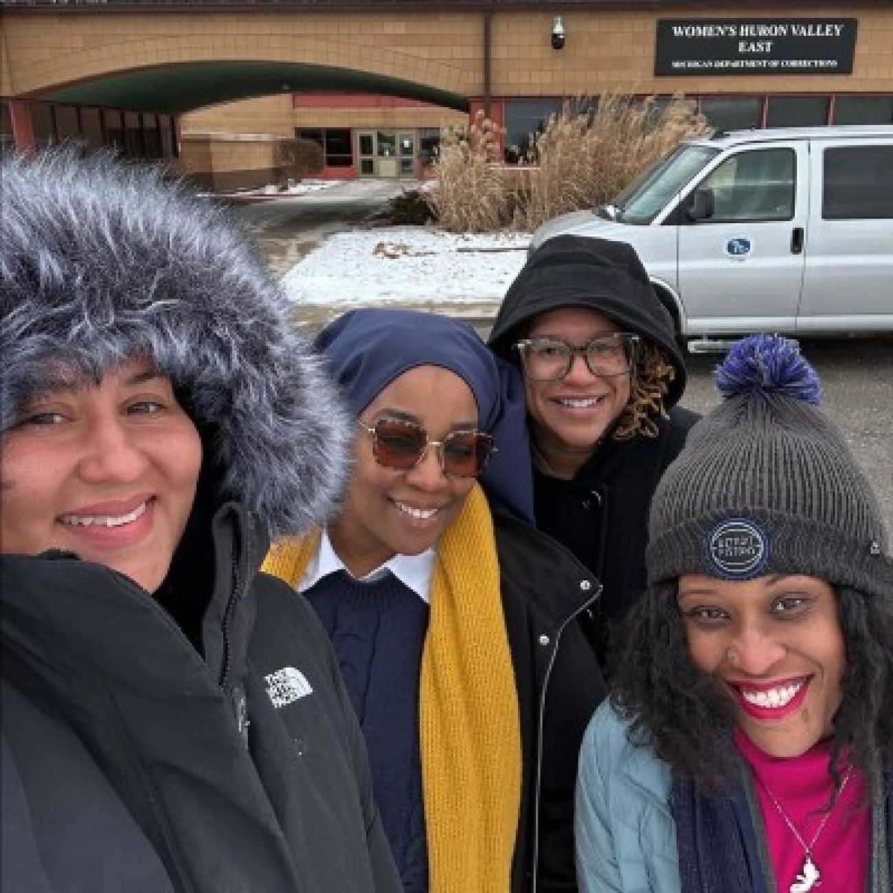 Four women pose for a selfie