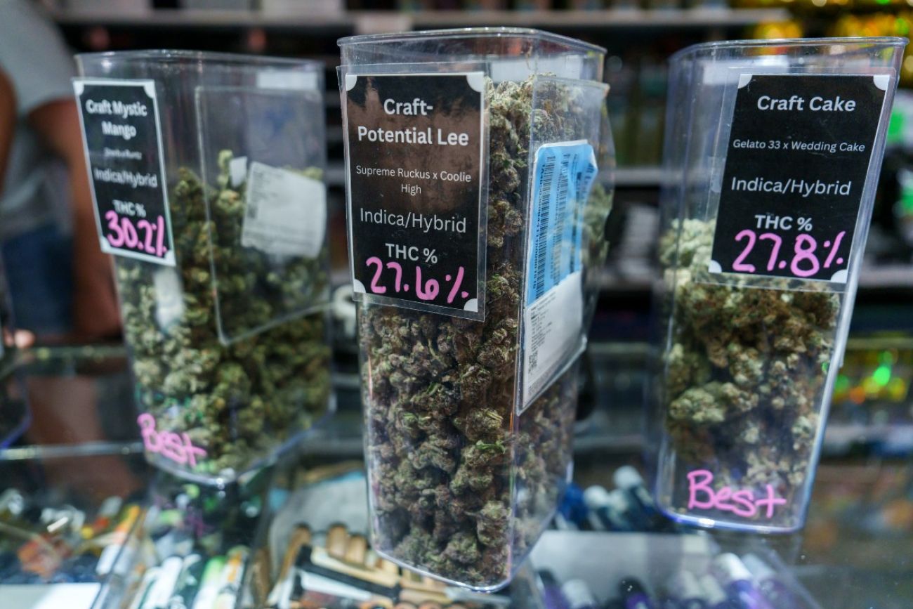 Marijuana is seen in jars on a counter at a marijuana dispensary