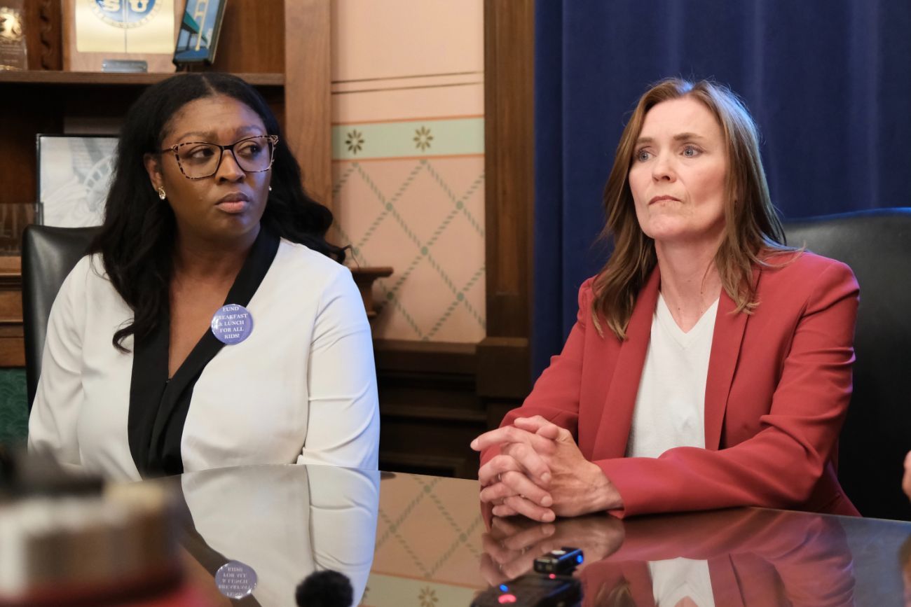 Michigan Senate Majority Leader Winnie Brinks, D-Grand Rapids, and Approrpations Chair Sarah Anthony, D-Lansing, sit at a table.