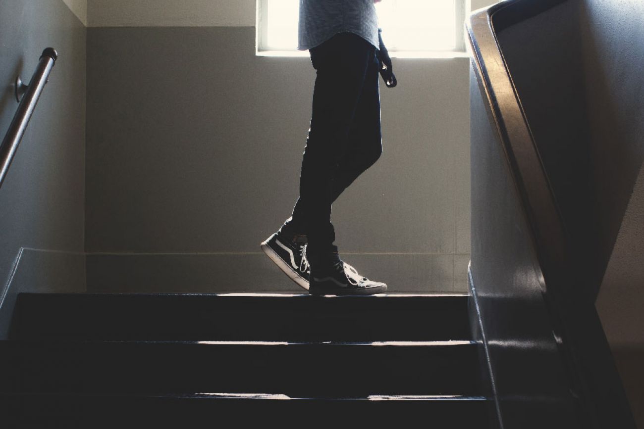 A student in a high school stairwell