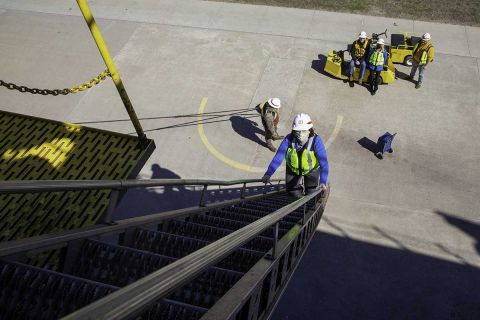 Public health worker Jill Schaefer, 49, disembarking the freighter Lee Tregurtha after vaccinating crew members. 