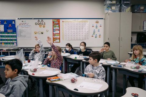 Students raising hands