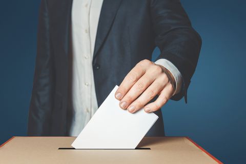 man with ballot