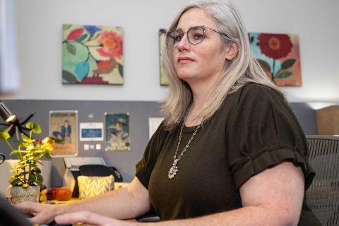 Adeline Hambley sitting at a desk